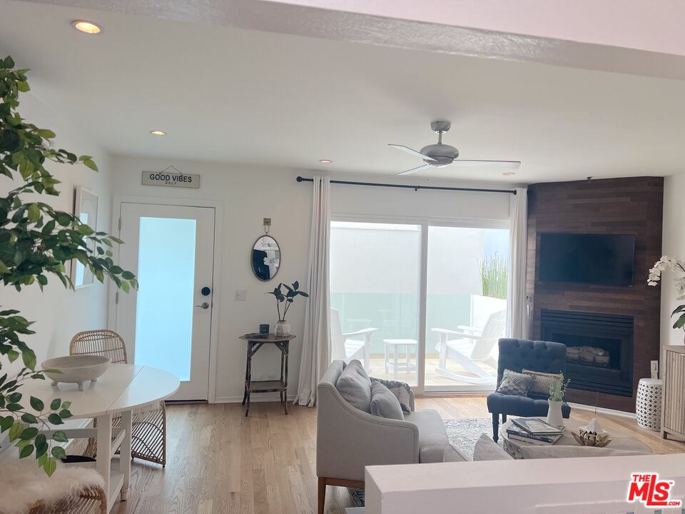25366 Malibu Road, Unit 2 Malibu, CA 90265 - Photo 6 of 25 a living room with furniture a flat screen tv and a large window