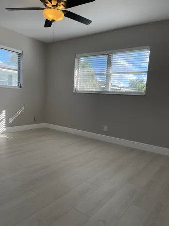 a view of an empty room with a fan