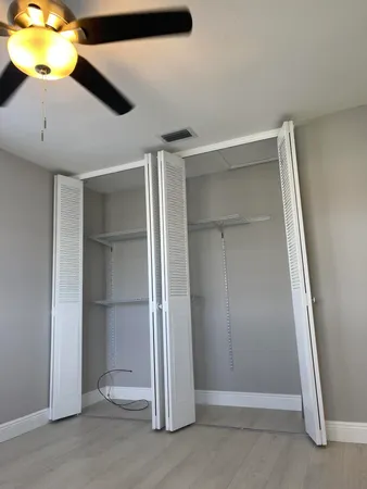 a bathroom with a toilet a sink and a window