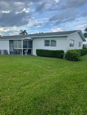a view of a yard in front of a house