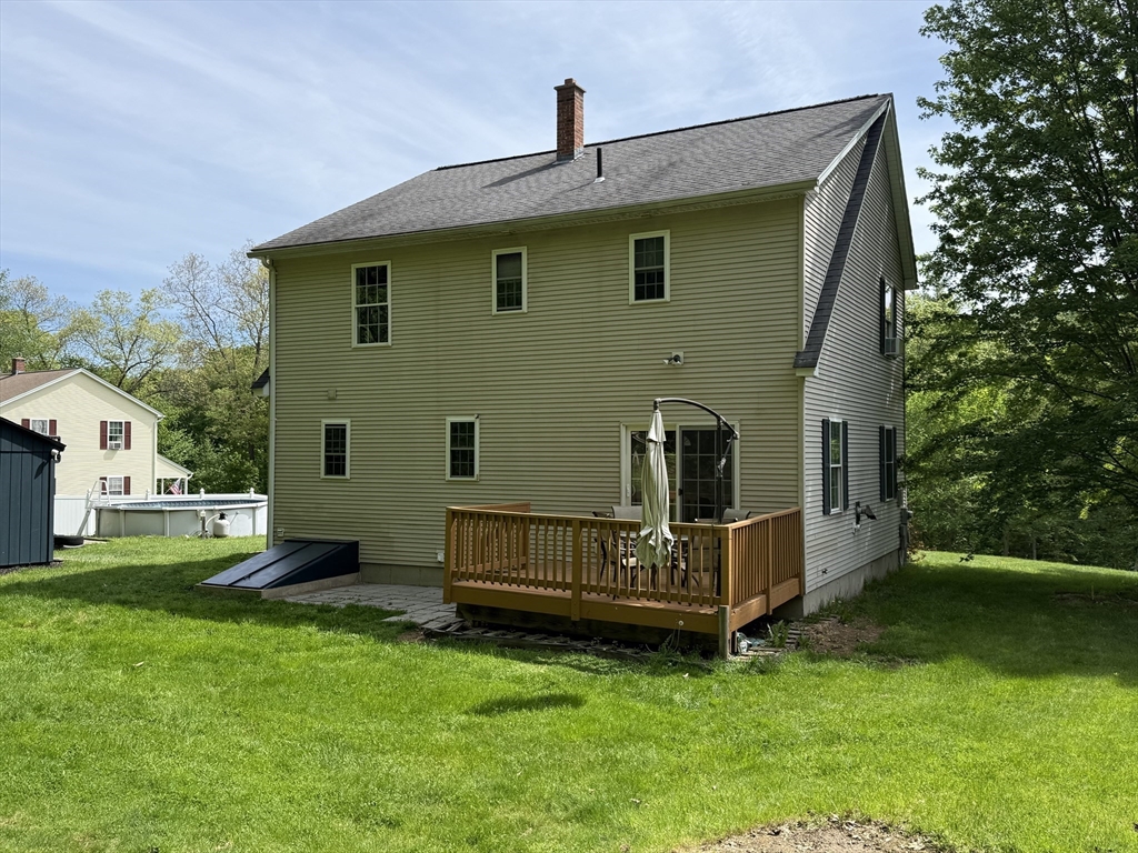222 Bridge Street Warren, MA 01083 - Photo 34 of 40 a view of backyard with a garden and deck