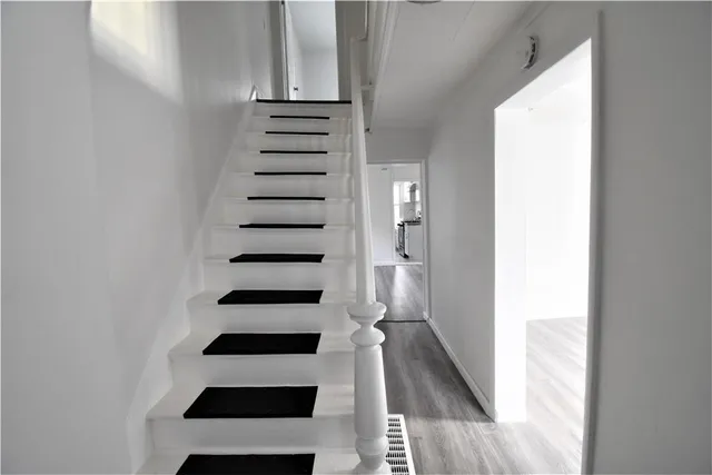 a view of entryway with wooden floor