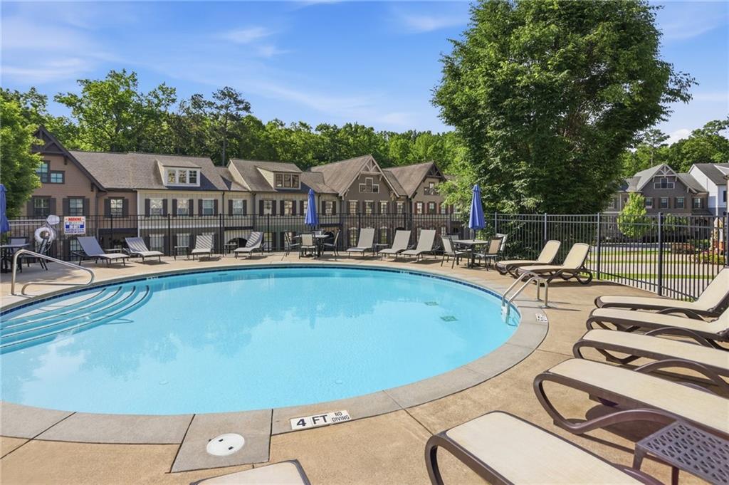 222 Trecastle Square, Unit 21 Canton, GA 30114 - Photo 33 of 33 a view of a swimming pool and lounge chairs