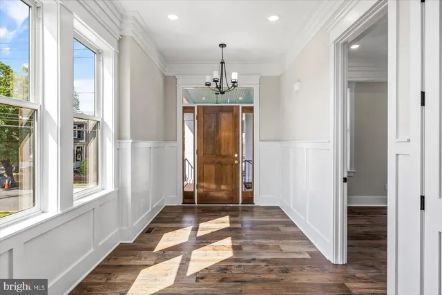 a kitchen with stainless steel appliances a sink a stove and cabinets