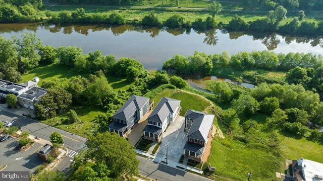 a view of a dining room with furniture wooden floor and a chandelier