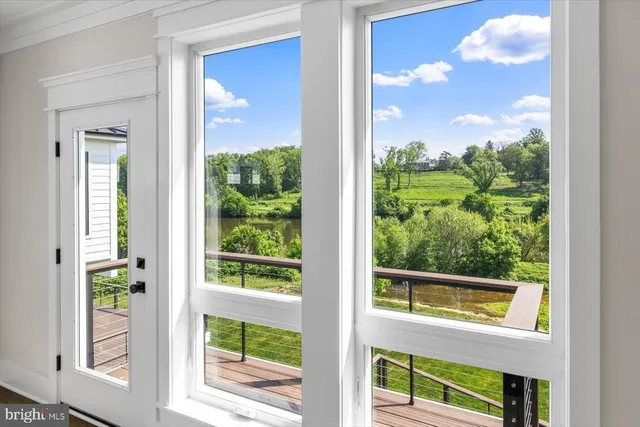 a view of hall way with furniture