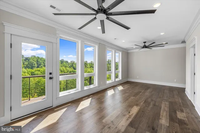 a view of a porch with wooden floor and outdoor space