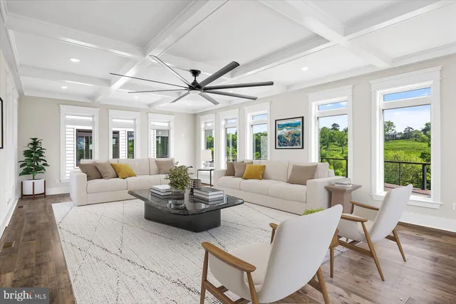 a view of a house with swimming pool and sitting area