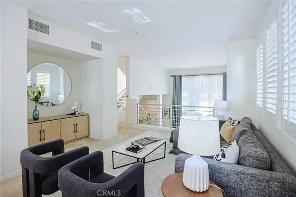 a large kitchen with kitchen island a stove a sink a dining table and chairs