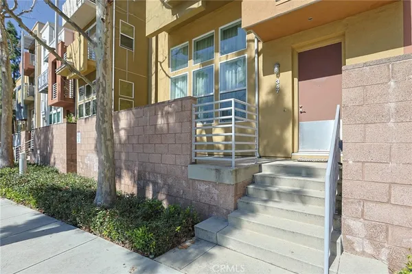 a view of a brick building next to a road