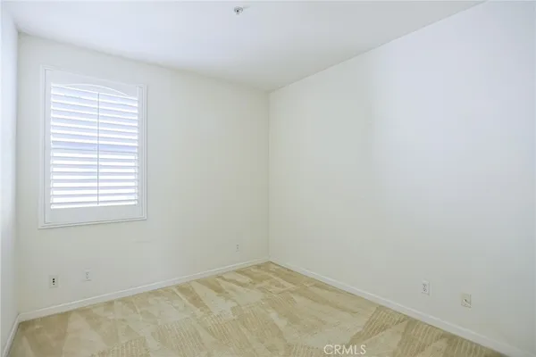a view of a living room with furniture and a fireplace
