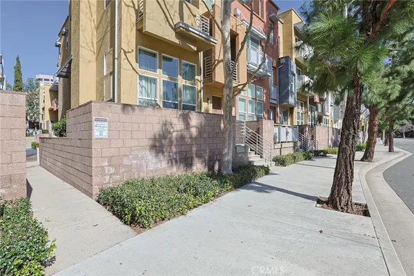 front view of a brick house with a yard