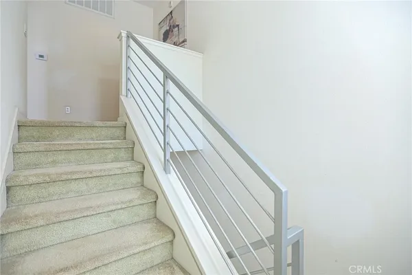 a view of balcony with wooden floor and fence