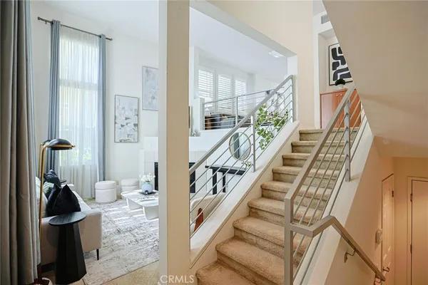 a living room with furniture a fireplace and a table