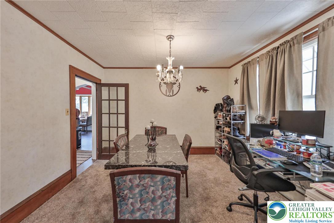 417 3rd Street Lehighton, PA 18235 - Photo 16 of 39 This versatile space accommodates both dining and office functions with warm wood trim and a central chandelier.