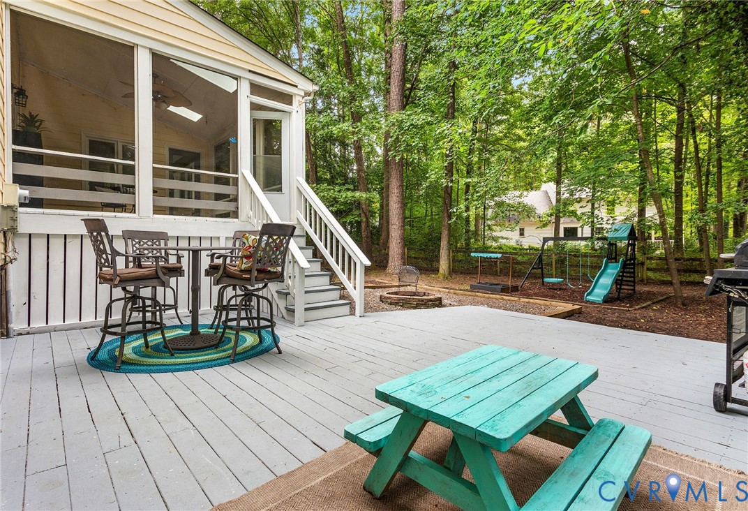 14305 Chimney House Road Midlothian, VA 23112 - Photo 41 of 49 a view of a patio with table and chairs with wooden floor and fence