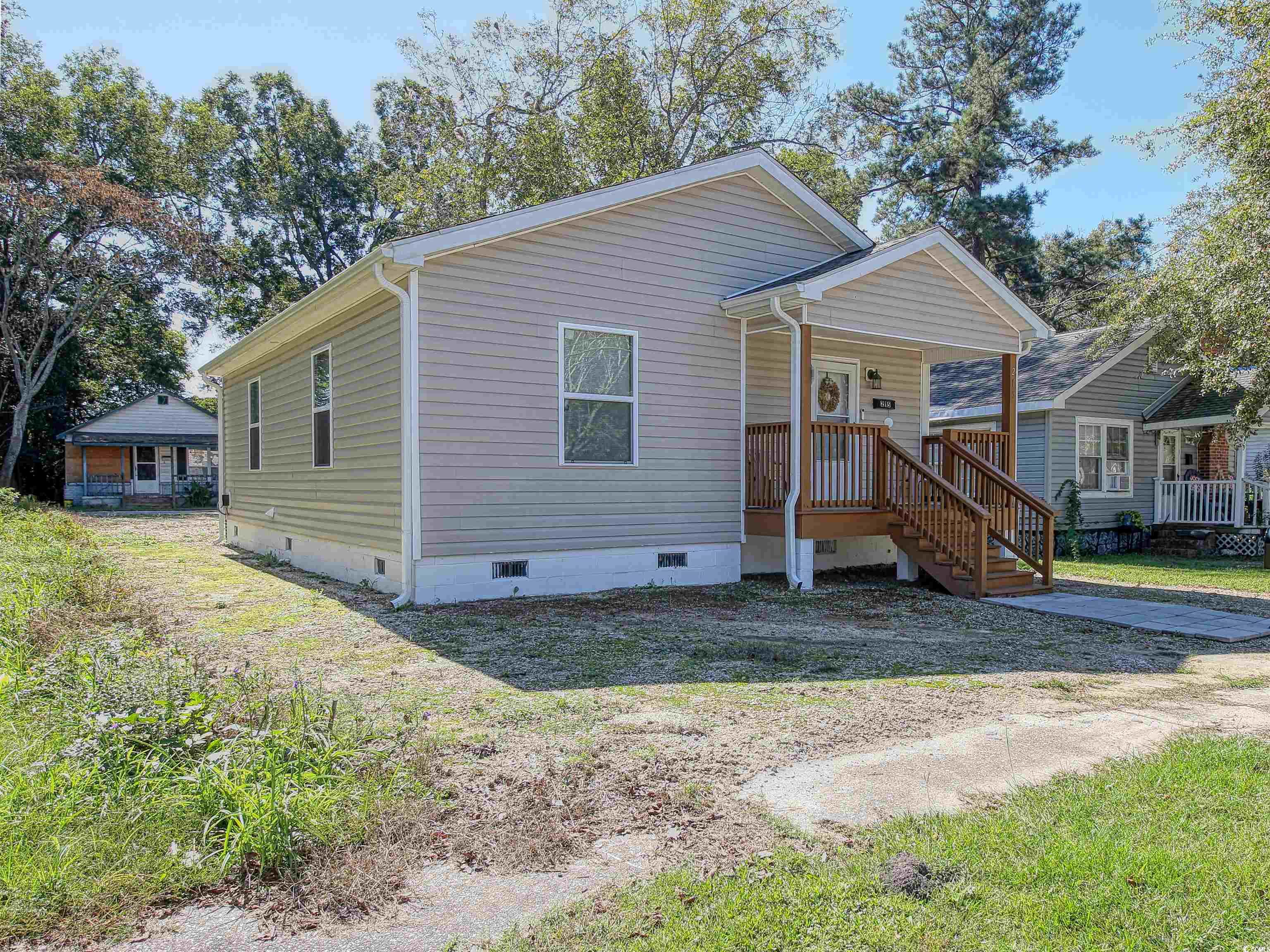215 West James Street Mullins, SC 29574 - Photo 15 of 18 View of front of house with crawl space and a porch