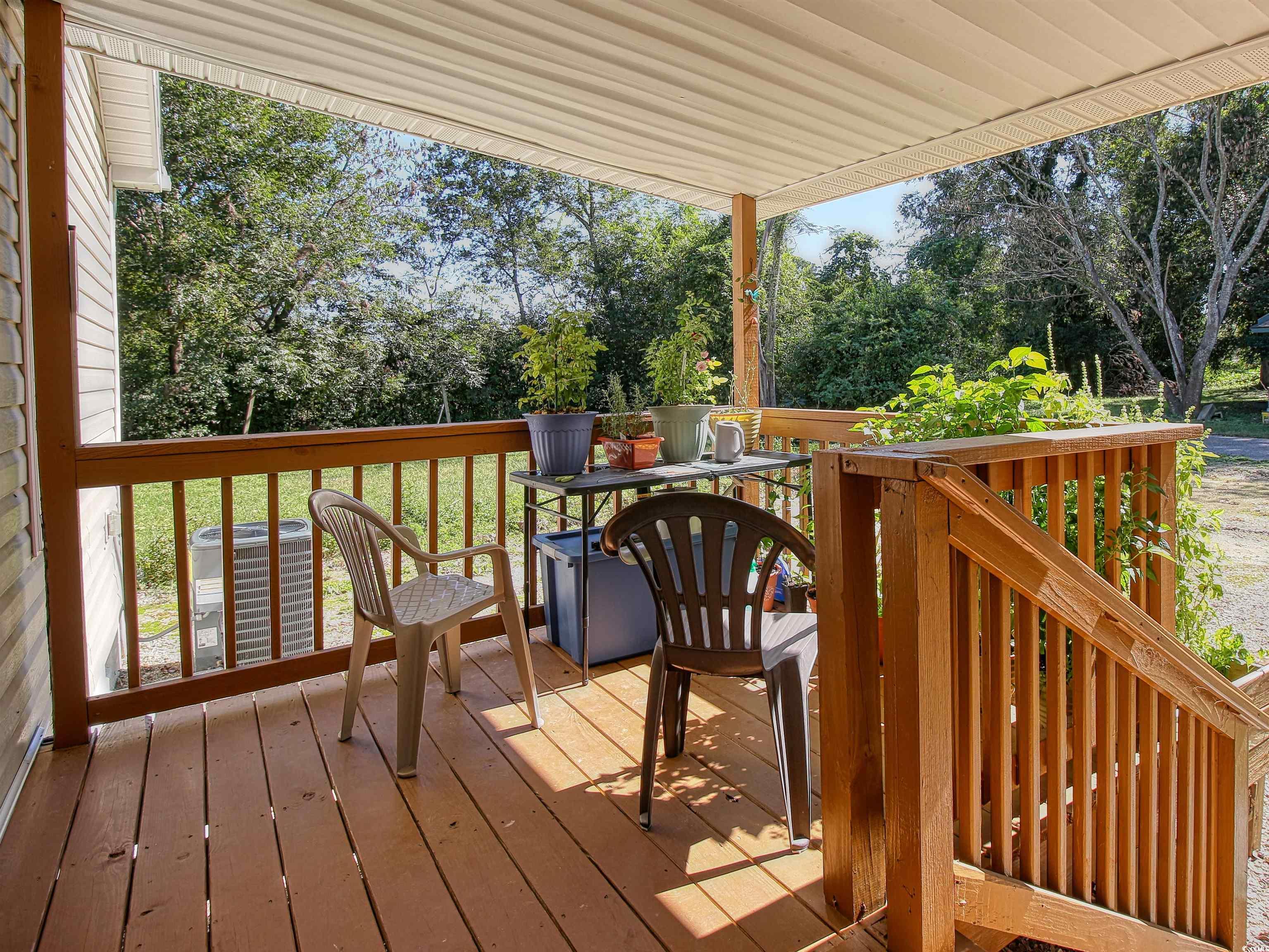 215 West James Street Mullins, SC 29574 - Photo 17 of 18 Wooden deck featuring view of scattered trees