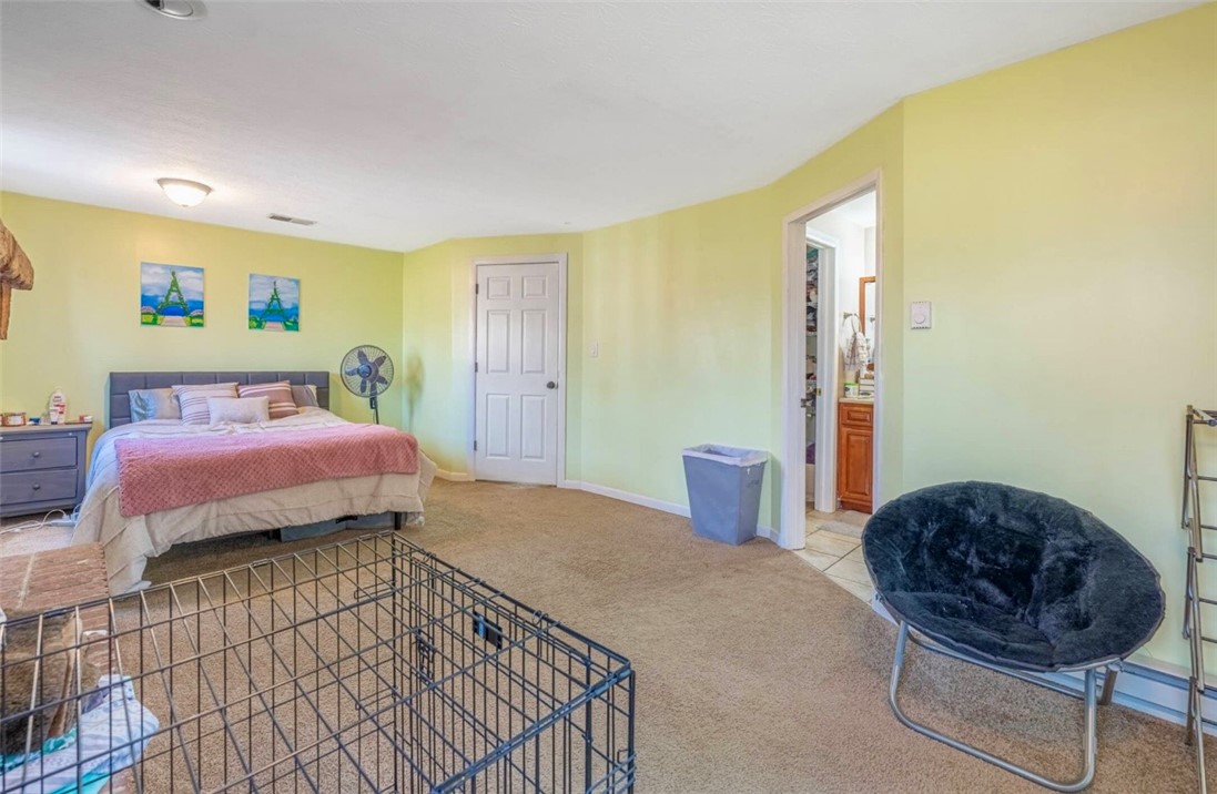 10 Monroe Road Lebanon, OH 45036 - Photo 9 of 14 This spacious bedroom offers ample comfort and direct access to a private bathroom.