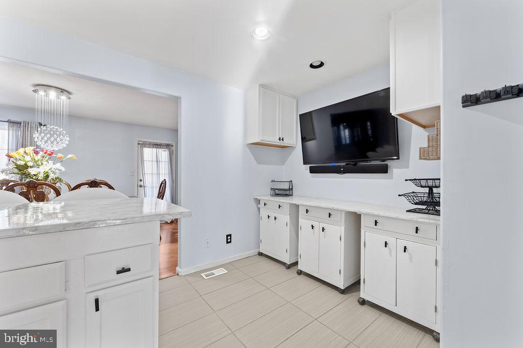 10335 Citation Way Ruther Glen, VA 22546 - Photo 12 of 47 a kitchen with cabinets stainless steel appliances and a sink