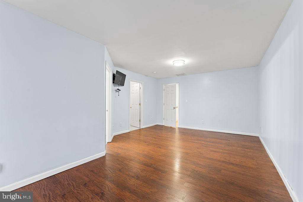 10335 Citation Way Ruther Glen, VA 22546 - Photo 18 of 47 a view of an empty room with wooden floor