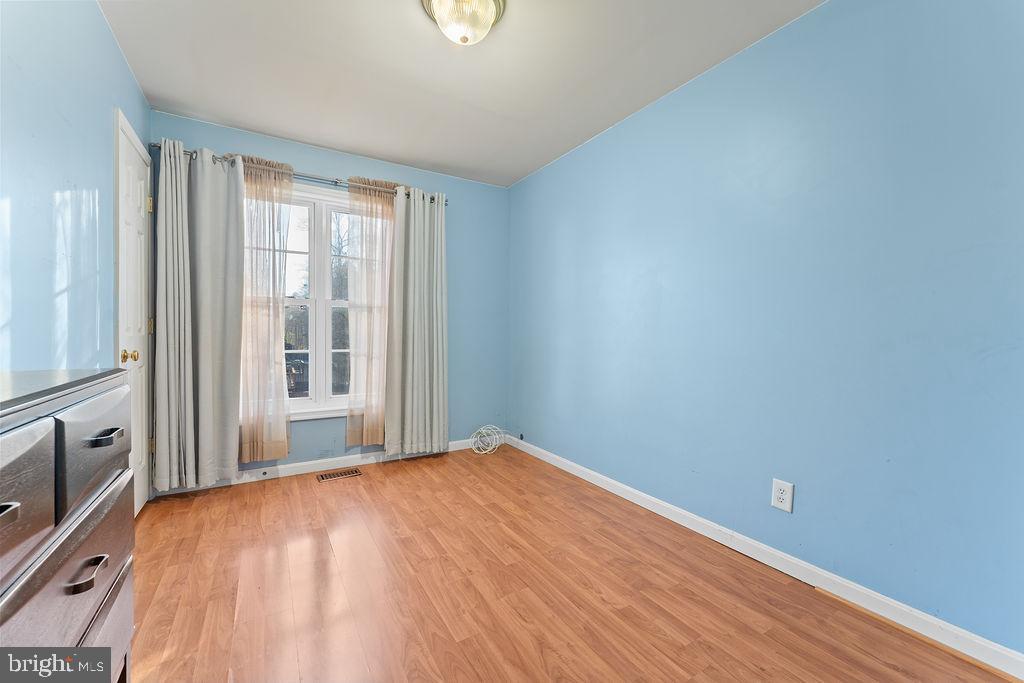 10335 Citation Way Ruther Glen, VA 22546 - Photo 22 of 47 a view of empty room with wooden floor and fan