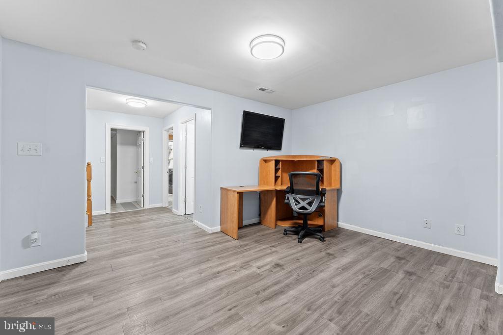 10335 Citation Way Ruther Glen, VA 22546 - Photo 25 of 47 a view of a workspace with furniture and wooden floor