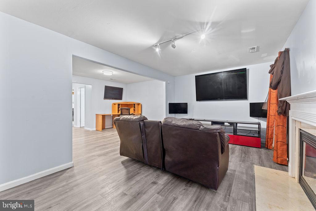10335 Citation Way Ruther Glen, VA 22546 - Photo 26 of 47 a living room with furniture and a flat screen tv