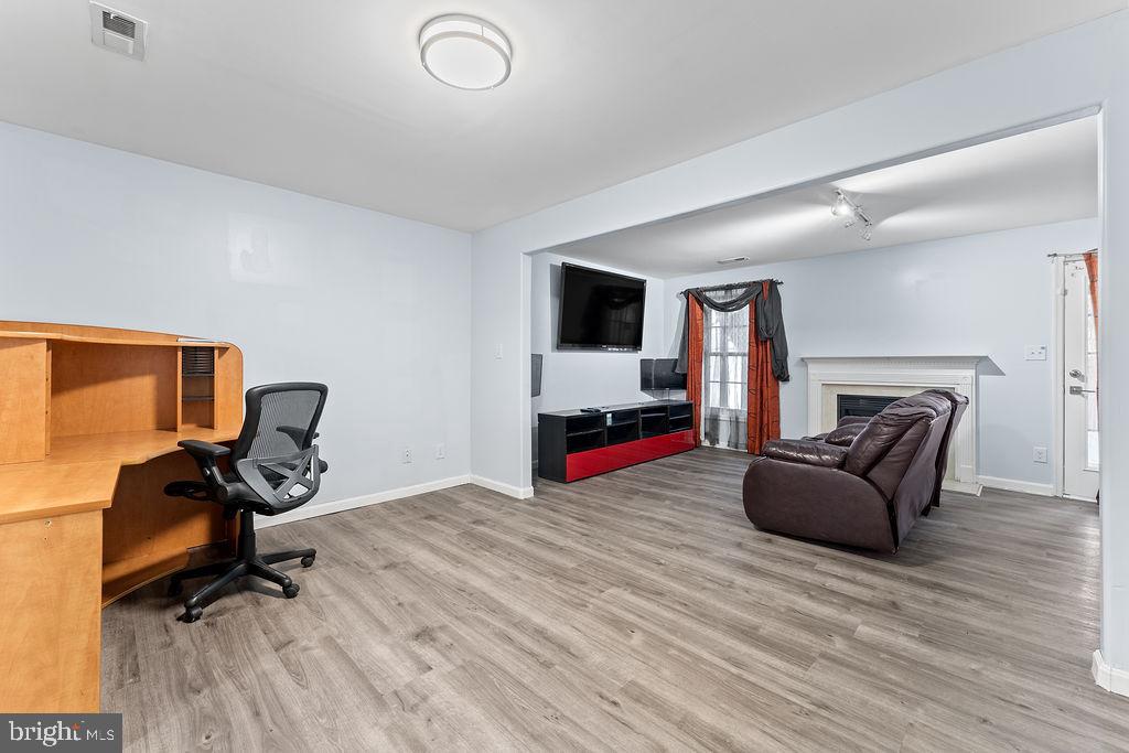 10335 Citation Way Ruther Glen, VA 22546 - Photo 27 of 47 a living room with furniture and a flat screen tv