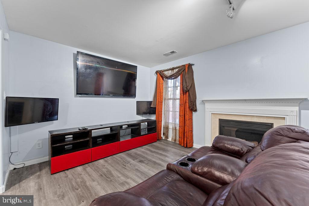 10335 Citation Way Ruther Glen, VA 22546 - Photo 28 of 47 a living room with furniture and a flat screen tv