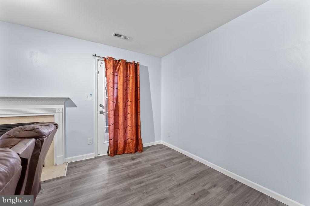 10335 Citation Way Ruther Glen, VA 22546 - Photo 30 of 47 a view of a livingroom with wooden floor and a fireplace