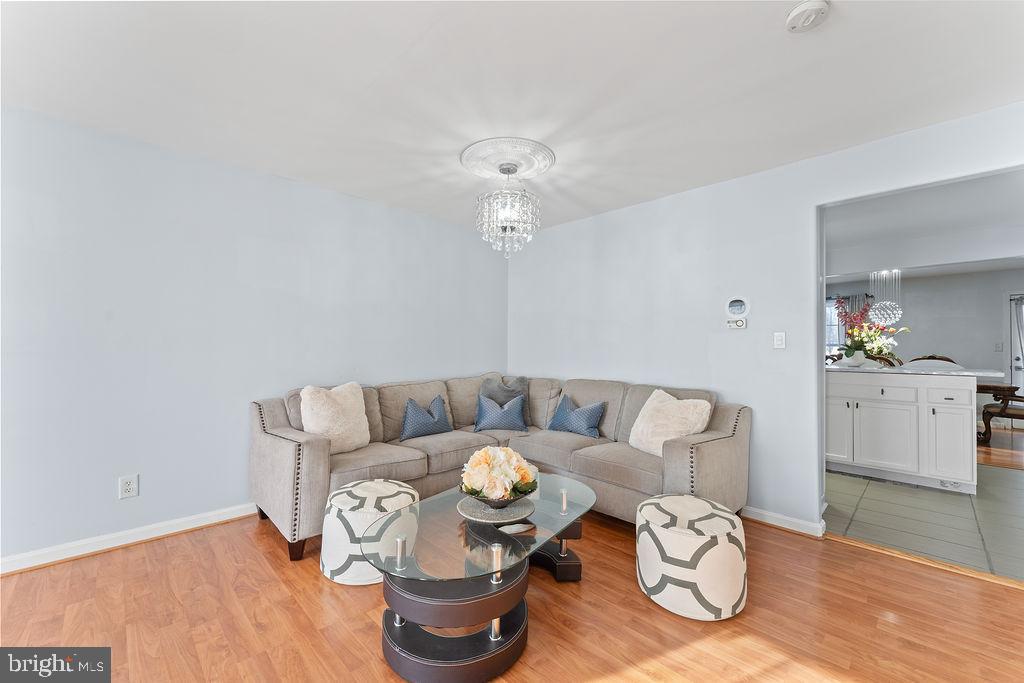 10335 Citation Way Ruther Glen, VA 22546 - Photo 3 of 47 a living room with furniture and a chandelier