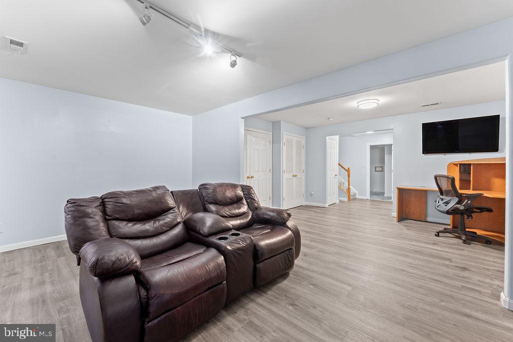 10335 Citation Way Ruther Glen, VA 22546 - Photo 31 of 47 a living room with furniture and a flat screen tv