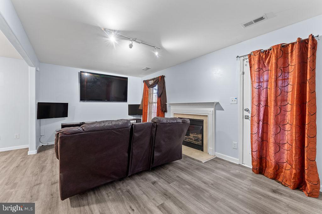 10335 Citation Way Ruther Glen, VA 22546 - Photo 32 of 47 a living room with furniture and a flat screen tv