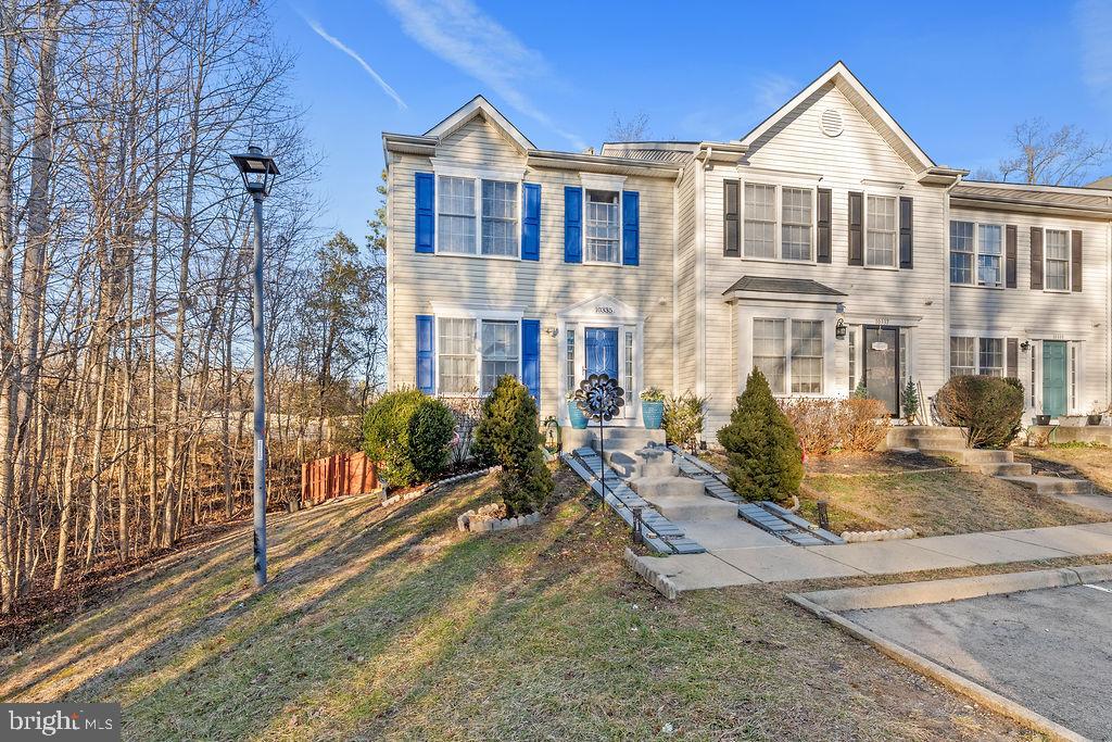 10335 Citation Way Ruther Glen, VA 22546 - Photo 43 of 47 a view of a big yard in front of a brick house with large windows