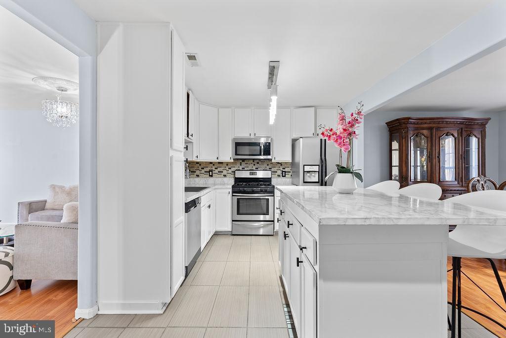 10335 Citation Way Ruther Glen, VA 22546 - Photo 8 of 47 a kitchen with a sink stove and cabinets
