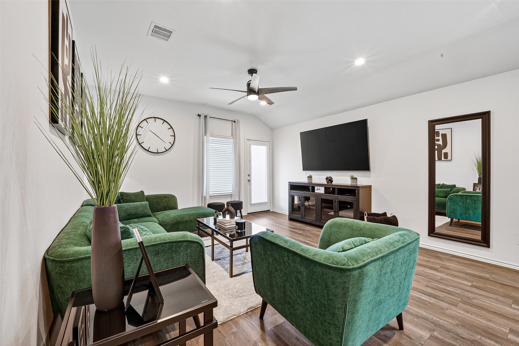 24318 Pebble Crescent Ln Spring Spring, TX 77373 - Photo 9 of 30 Spacious open-concept living room filled with abundant natural light, creating the perfect space for relaxing, entertaining, and gathering with family and friends.