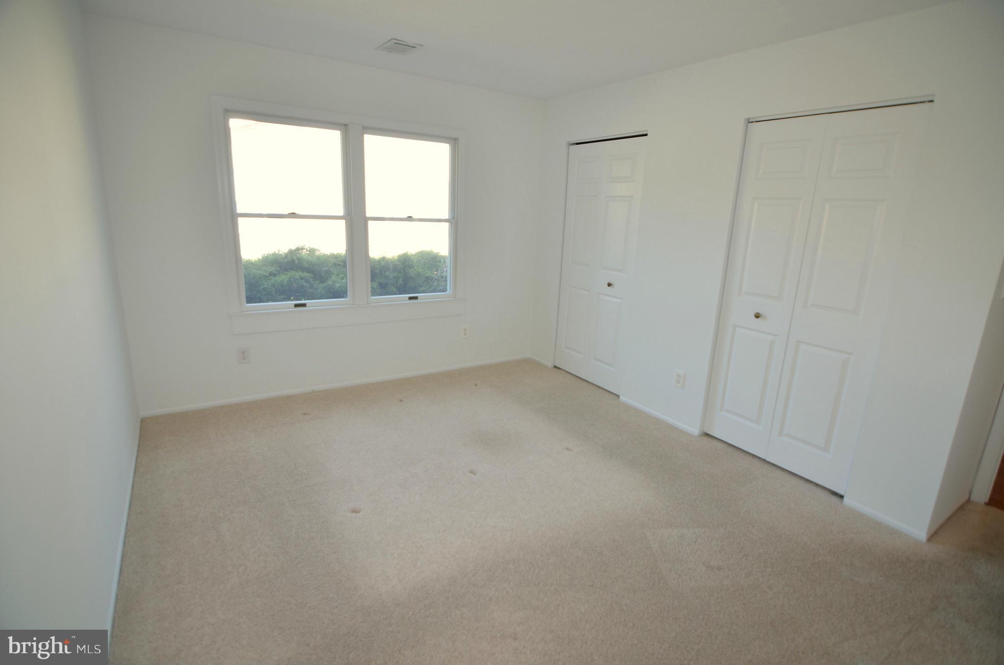 8222 Grainfield Road Severn, MD 21144 - Photo 22 of 30 an empty room with a window