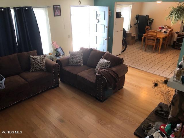 561 Spring Road, Unit 43 Moorpark, CA 93021 - Photo 3 of 8 a living room with furniture and a flat screen tv
