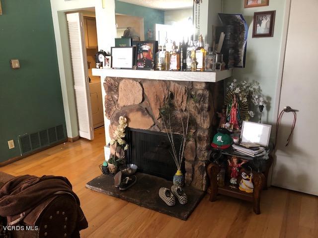 561 Spring Road, Unit 43 Moorpark, CA 93021 - Photo 4 of 8 a room with furniture and a fireplace