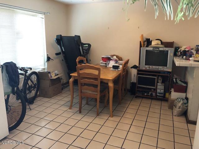 561 Spring Road, Unit 43 Moorpark, CA 93021 - Photo 5 of 8 a room with furniture a flat screen computer and a window