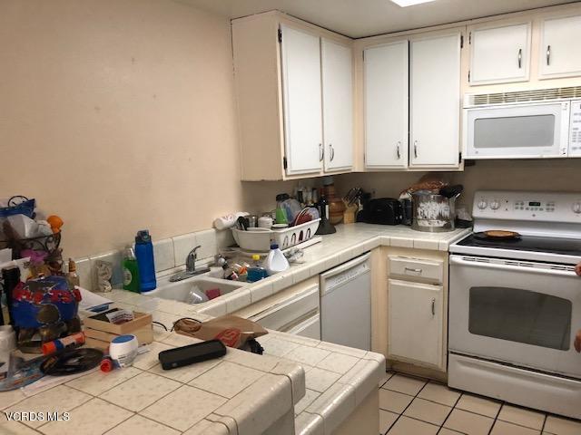 561 Spring Road, Unit 43 Moorpark, CA 93021 - Photo 6 of 8 a kitchen with a sink cabinets and appliances