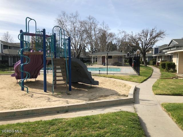 561 Spring Road, Unit 43 Moorpark, CA 93021 - Photo 7 of 8 a view of a house with a swimming pool