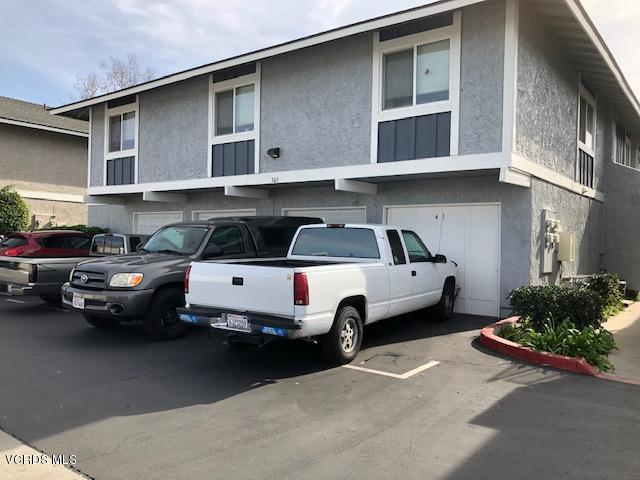 561 Spring Road, Unit 43 Moorpark, CA 93021 - Photo 8 of 8 a car parked in front of a house