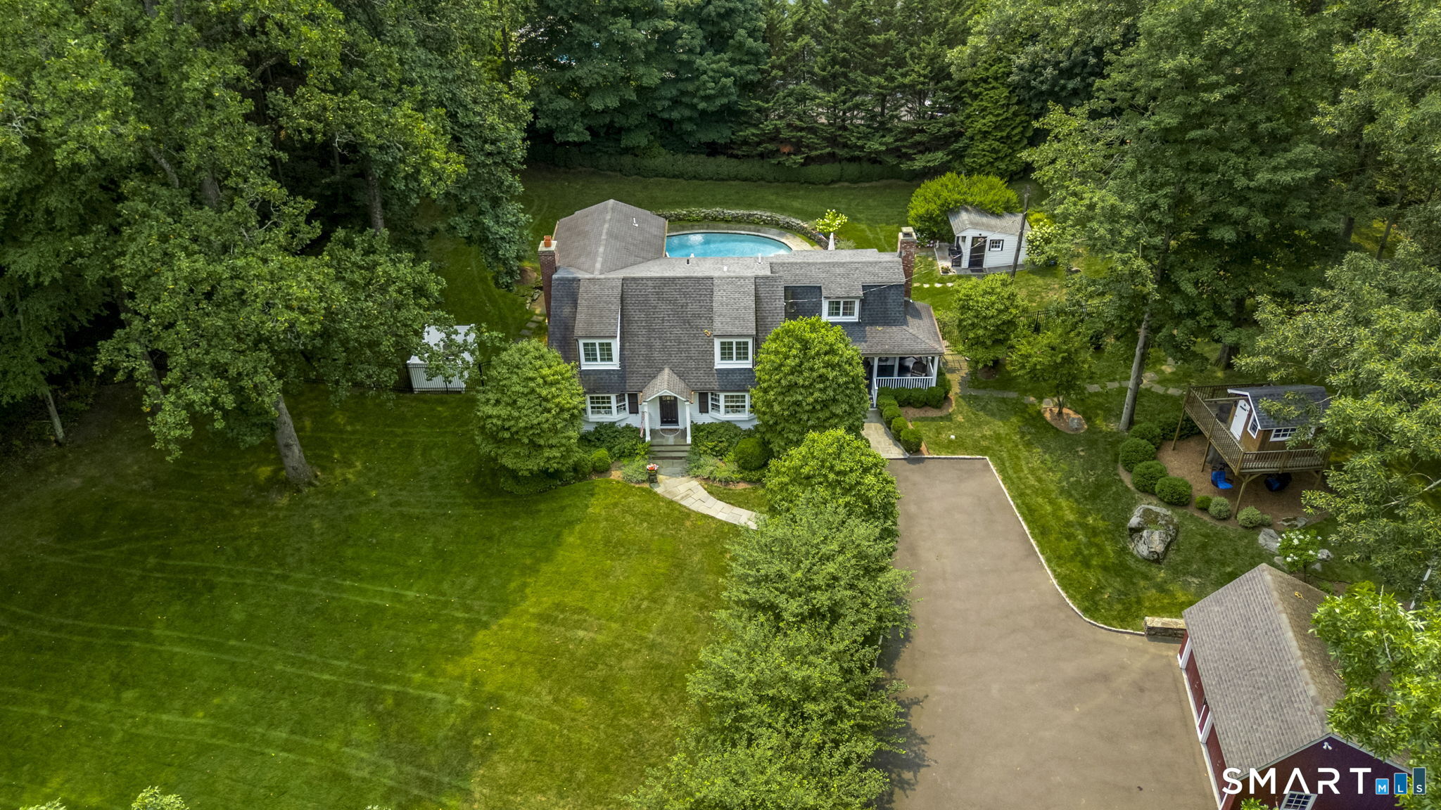 A tree lined drive welcomes you home