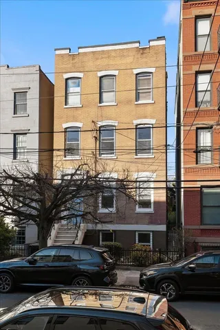 a front view of a building with balcony