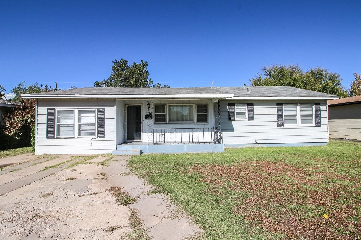 3814 32nd Street Lubbock, TX 79410 - Photo 1 of 10 a front view of a house with a yard