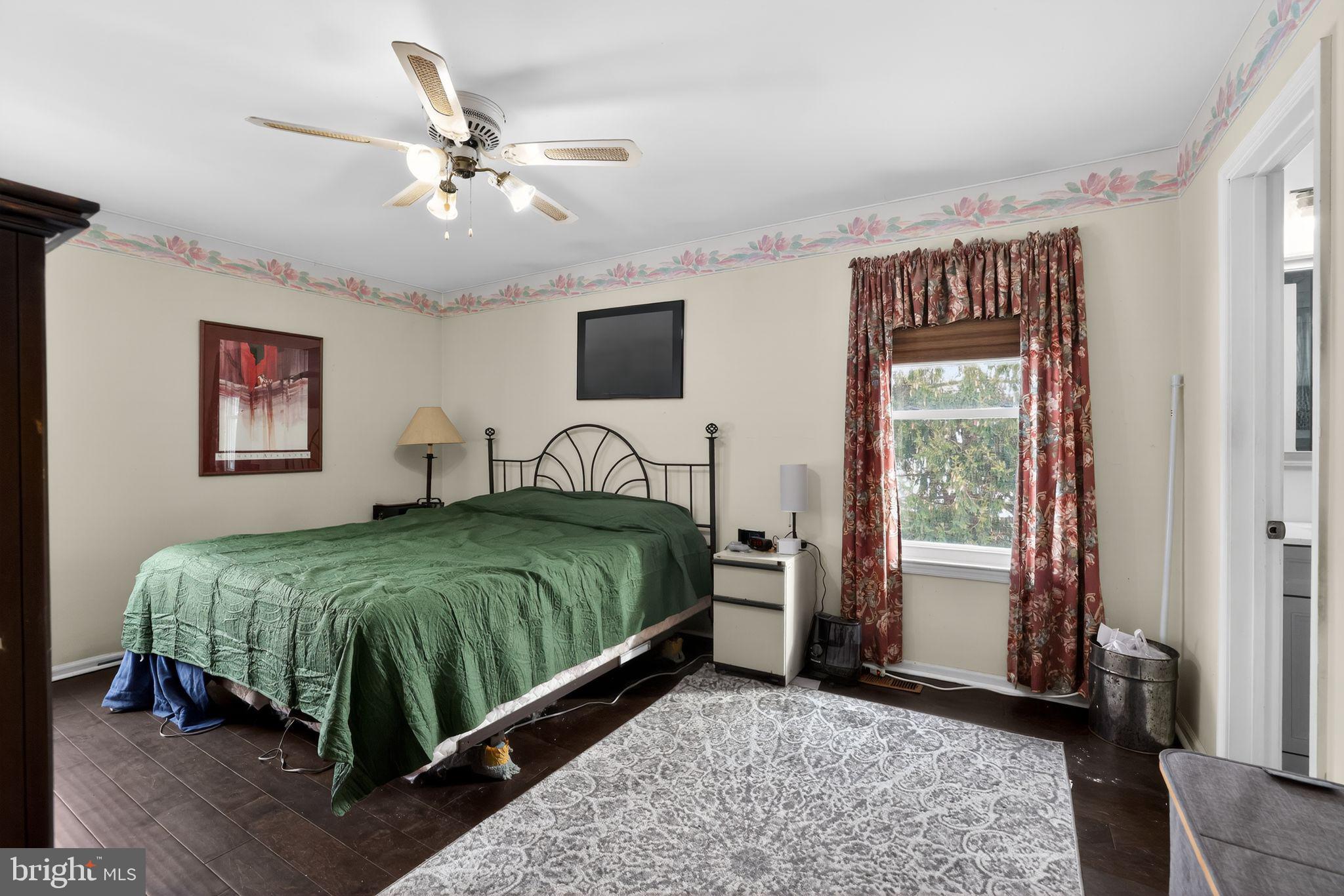 1997 Sunrise Way Jamison, PA 18929 - Photo 12 of 38 a bedroom with a bed and a chandelier