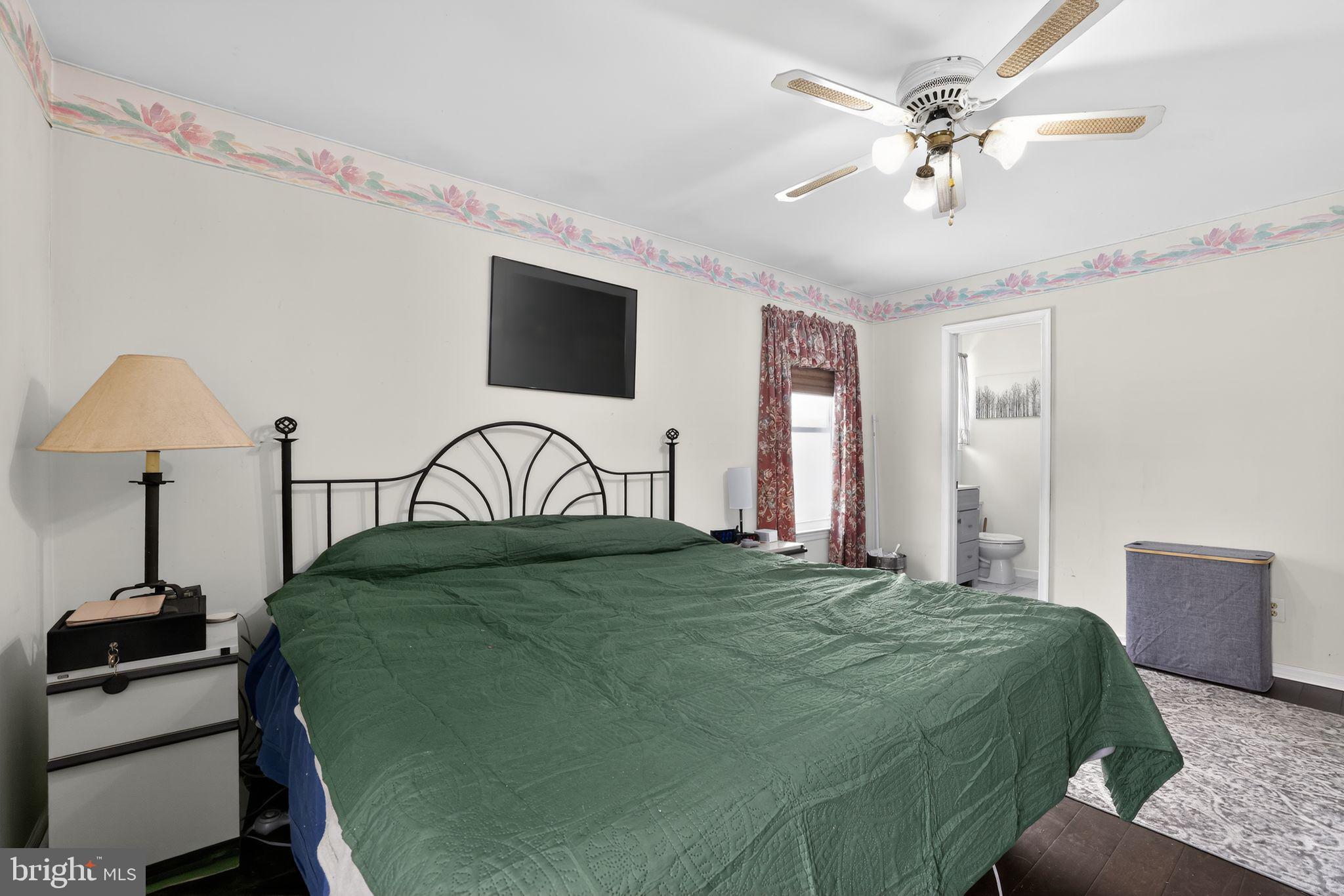 1997 Sunrise Way Jamison, PA 18929 - Photo 15 of 38 a bedroom with a bed and a chandelier