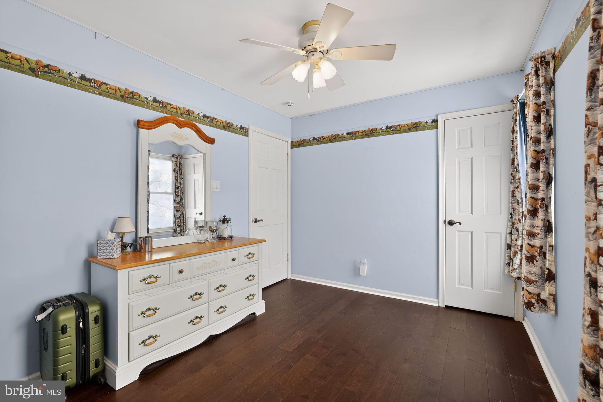 1997 Sunrise Way Jamison, PA 18929 - Photo 17 of 38 a view of a bedroom with a large bed and a chandelier fan